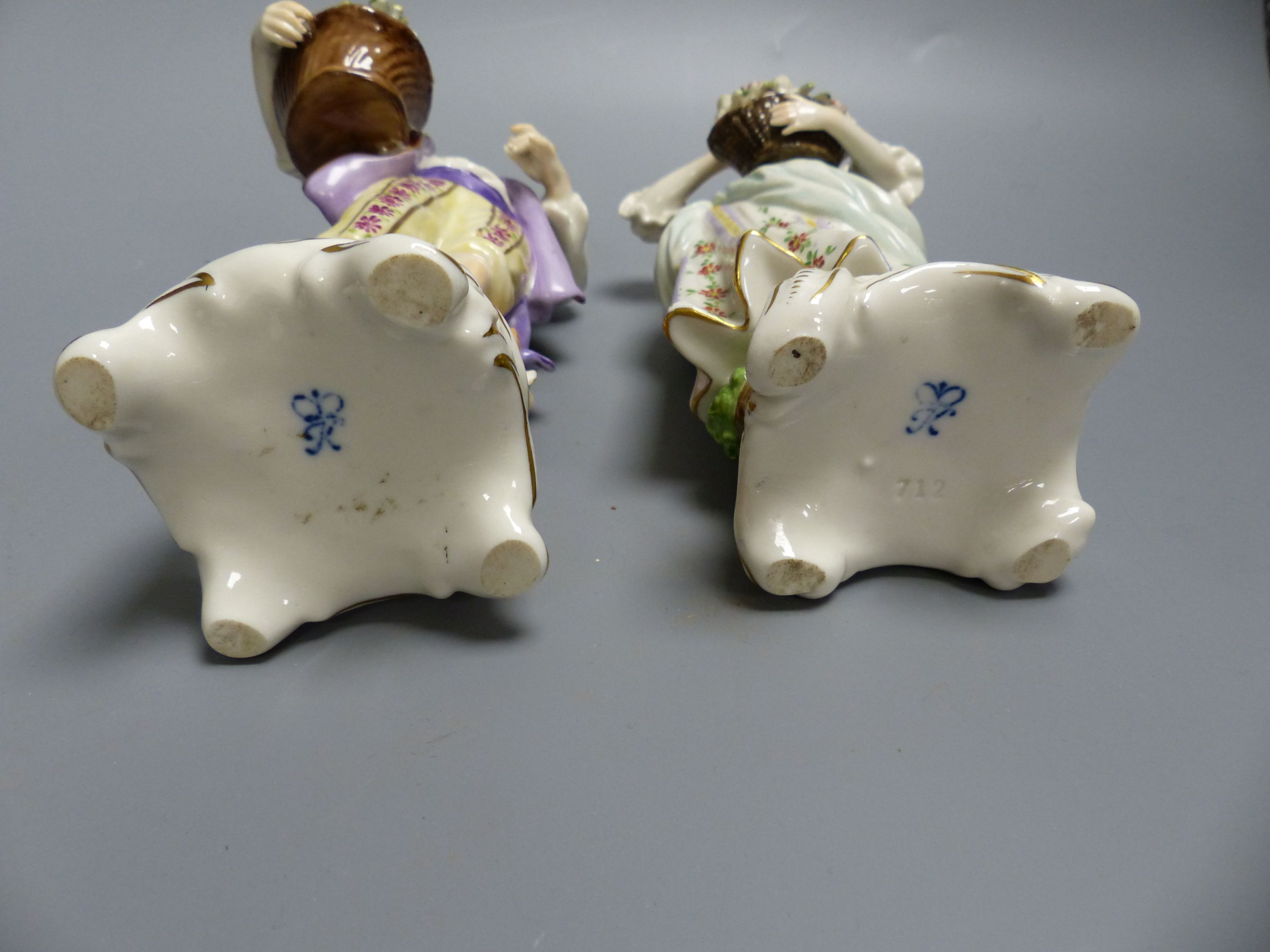 A pair of Rudolf Kammer porcelain figures of flower carriers, height 23cm